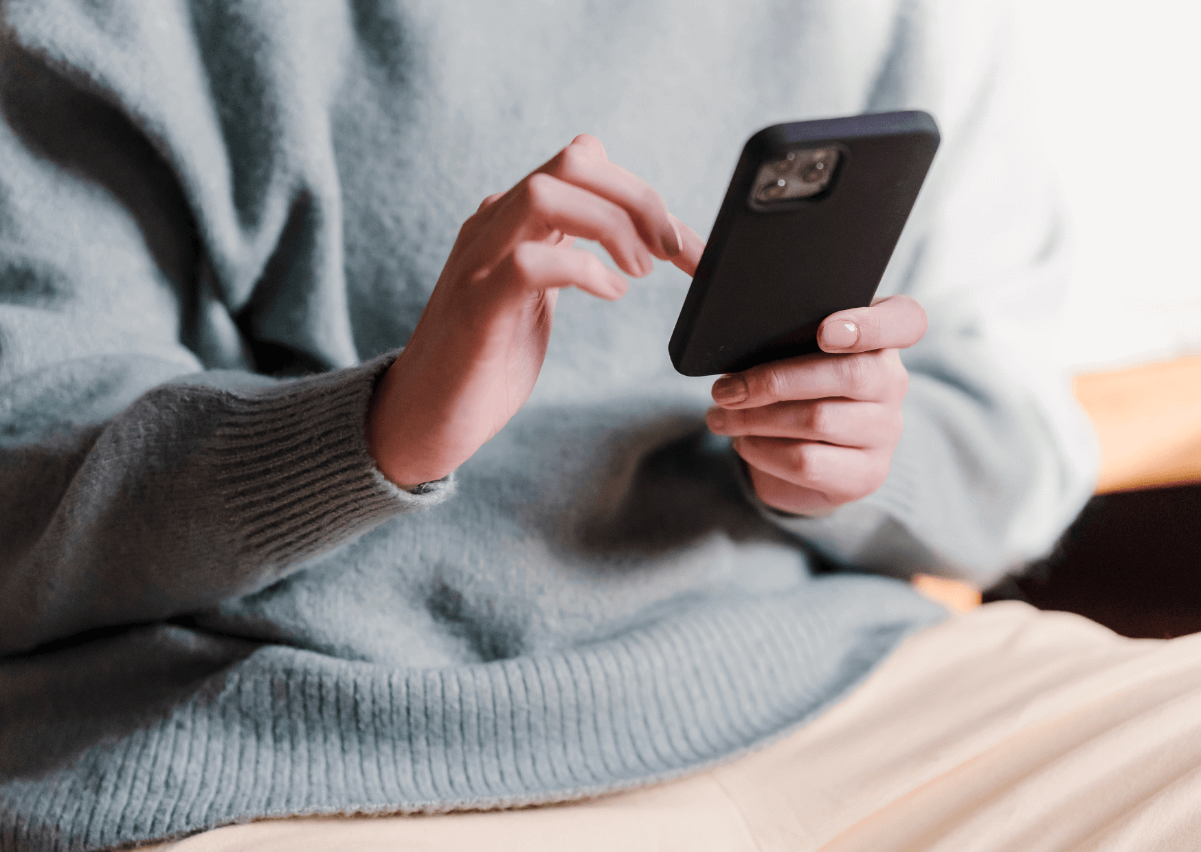 cozy picture of person holding a phone